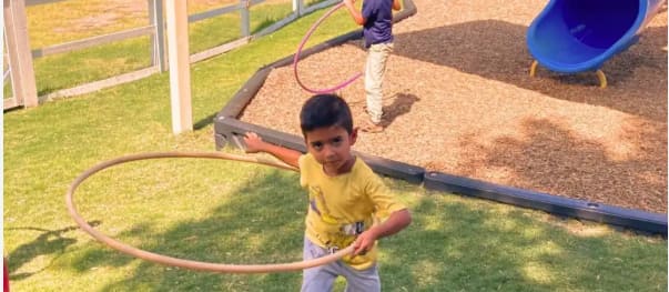 Parent and child walking hand-in-hand on a dirt path, enjoying connection and healthy physical movement outdoors.