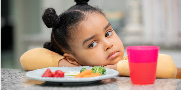 child-trying-one-scientist-bite-of-new-food
