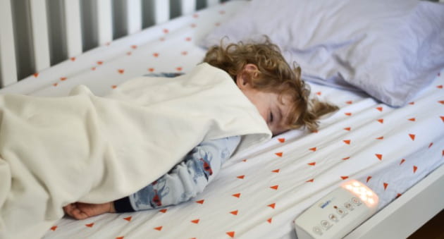 toddler climbing out of crib