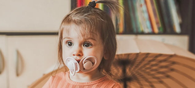 speech development delay binky